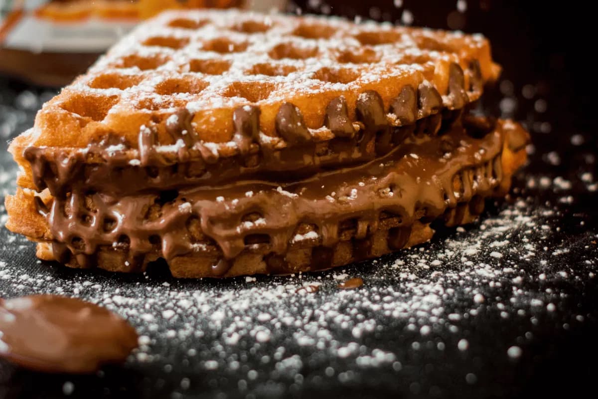 Waffle cookies cooked in a waffle iron and dusted with icing sugar