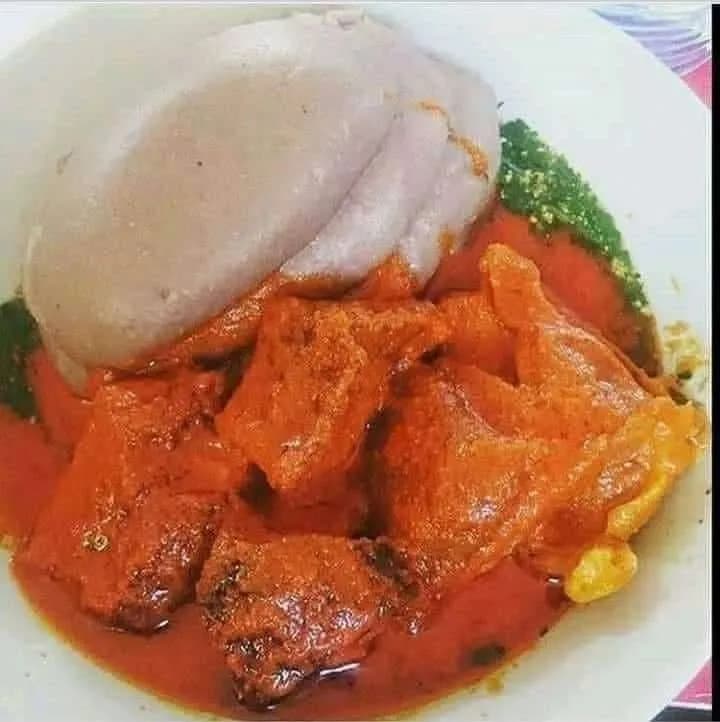 White amala with ilasa soup, a Yoruba pairing of cassava flour swallow and okra leaf soup